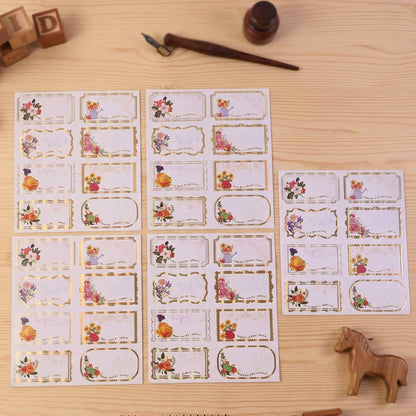 Set of 40 floral foil gift tag stickers with "Best Compliments" message from Wukusy, featuring elegant designs for gift wrapping.