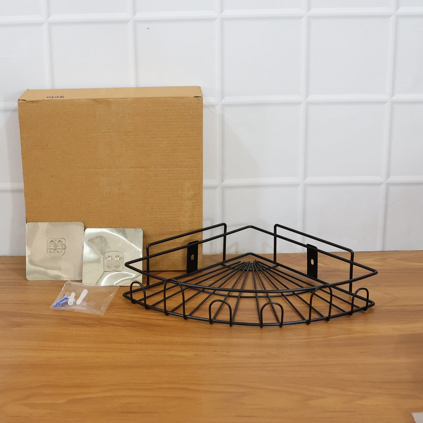 Wall-mounted corner bathroom storage rack by Wukusy, shown installed in a bathroom corner for organizing toiletries.