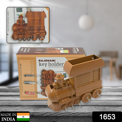 Plastic train engine key holder by Wukusy, decorative key organizer with a vintage train design for home or office use.