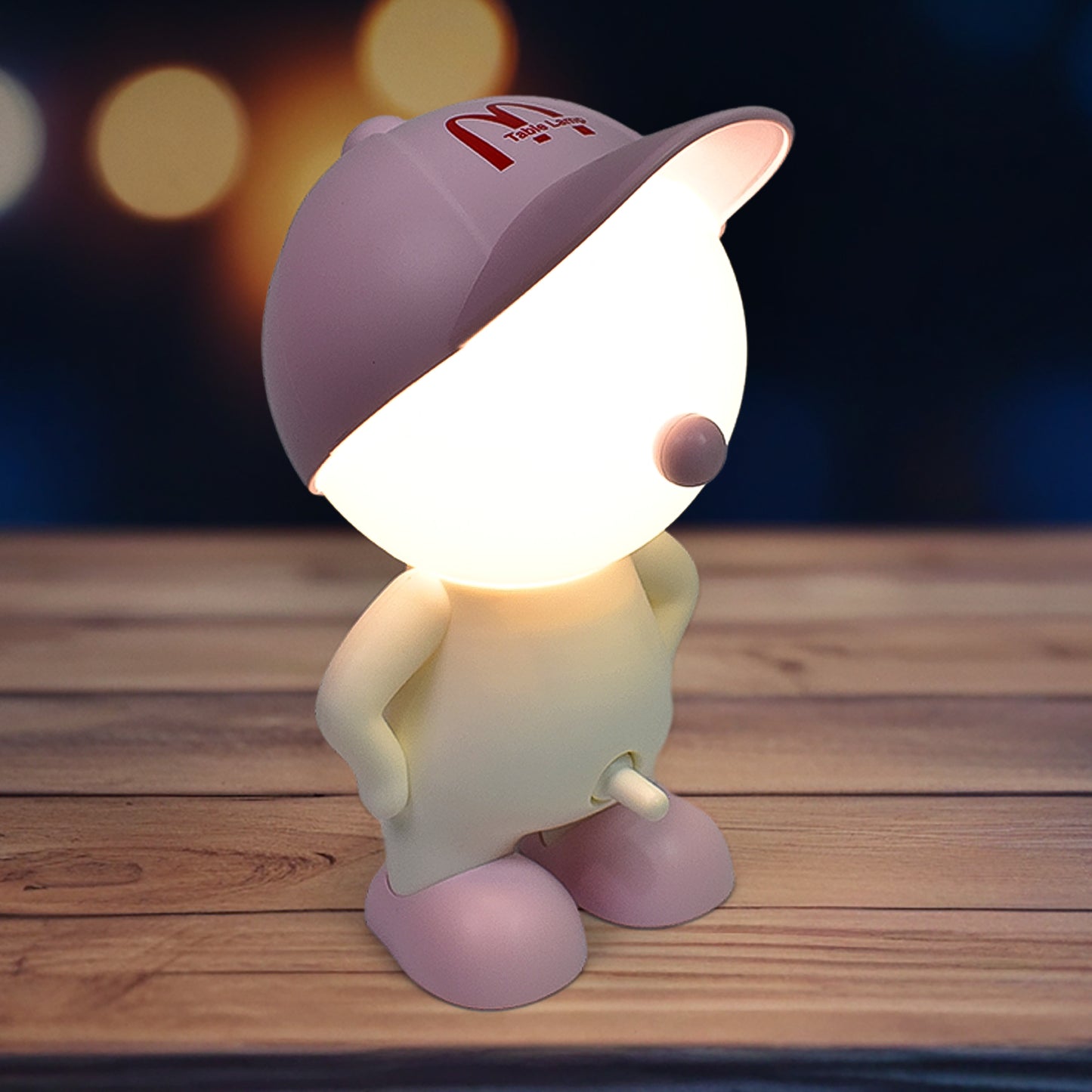 Cute cartoon-style LED desk night light with plastic head cap, ideal for home decor and night-time lighting by Wukusy.