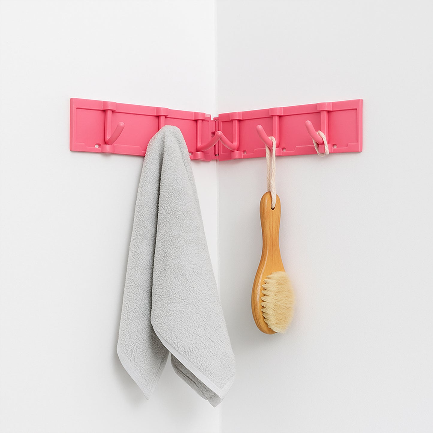 Wall-mounted foldable 6-hook rack by Wukusy, rotating and versatile for home and kitchen organization.