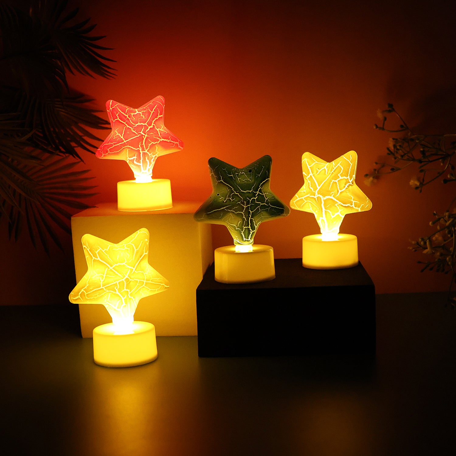 Set of four star-shaped decorative LED tealight candles by Wukusy, ideal for home decor and ambient lighting.