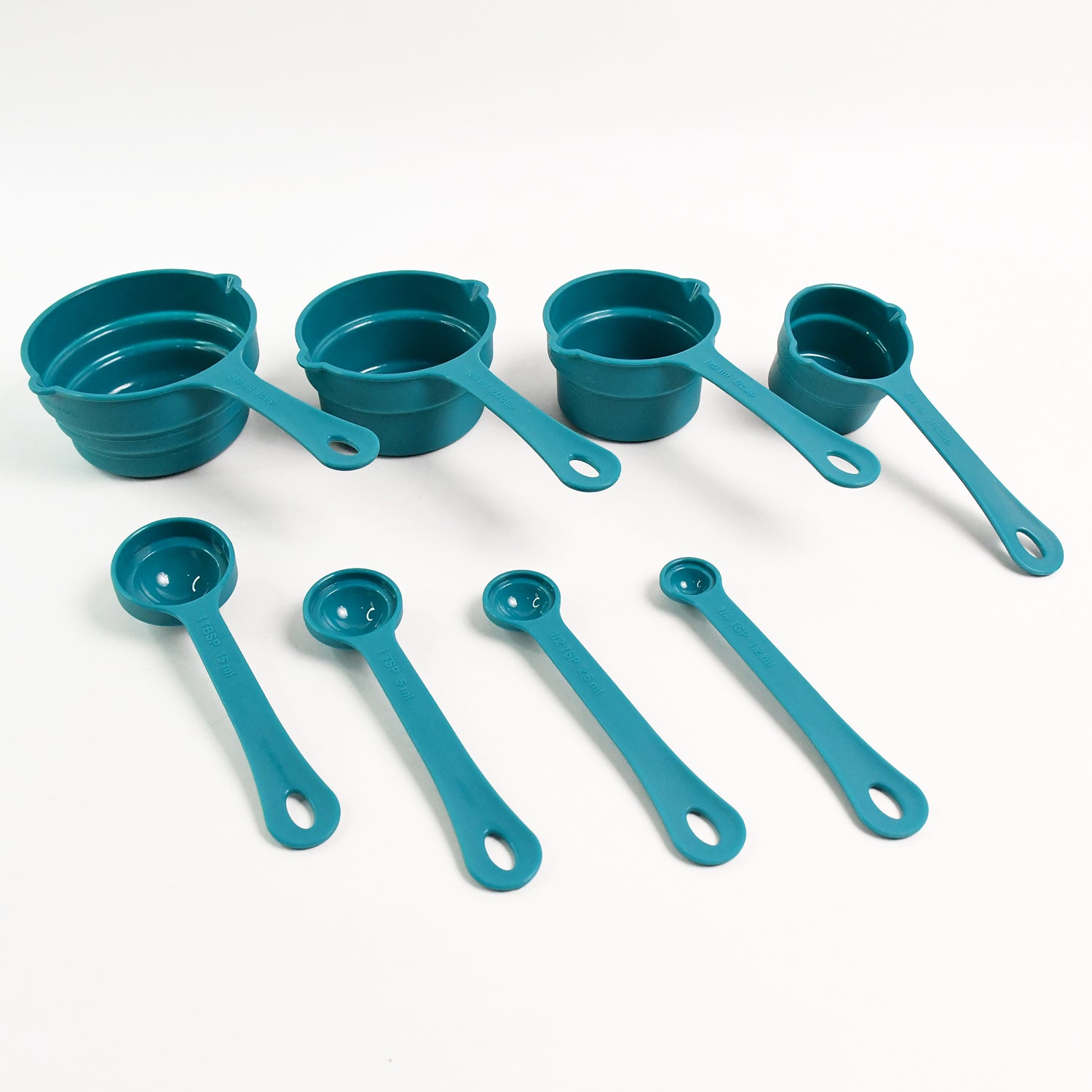 Wukusy Apex 8-piece measuring spoons and cups set for precise cooking and baking in home kitchen.