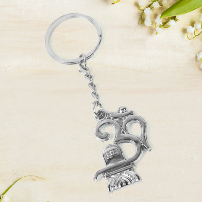 Metal keychain featuring Om symbol and Shivling design by Wukusy, attached to a keyring with detailed craftsmanship.