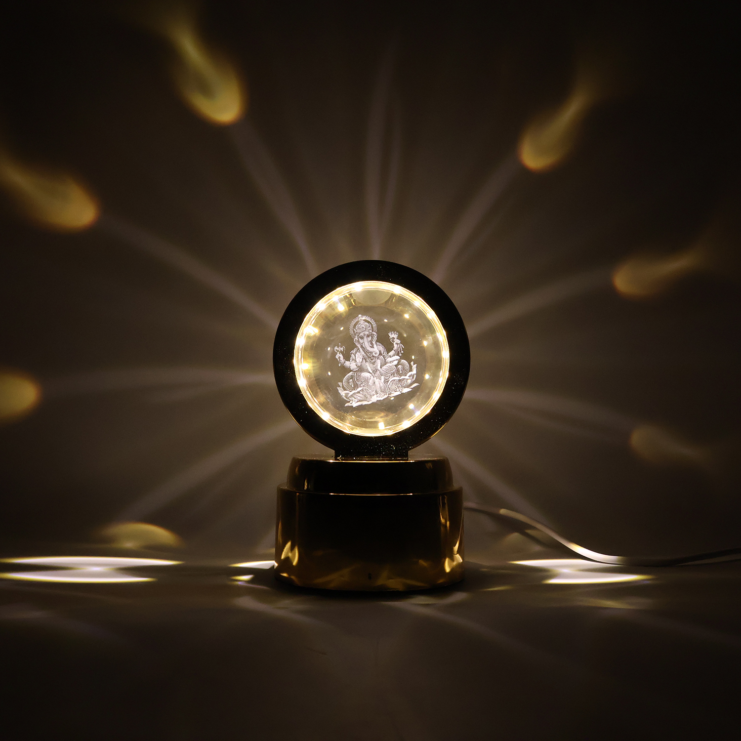 Wukusy Ganpati Bapa 3D crystal ball night light with LED illumination, designed for office decor, featuring intricate Ganpati design.