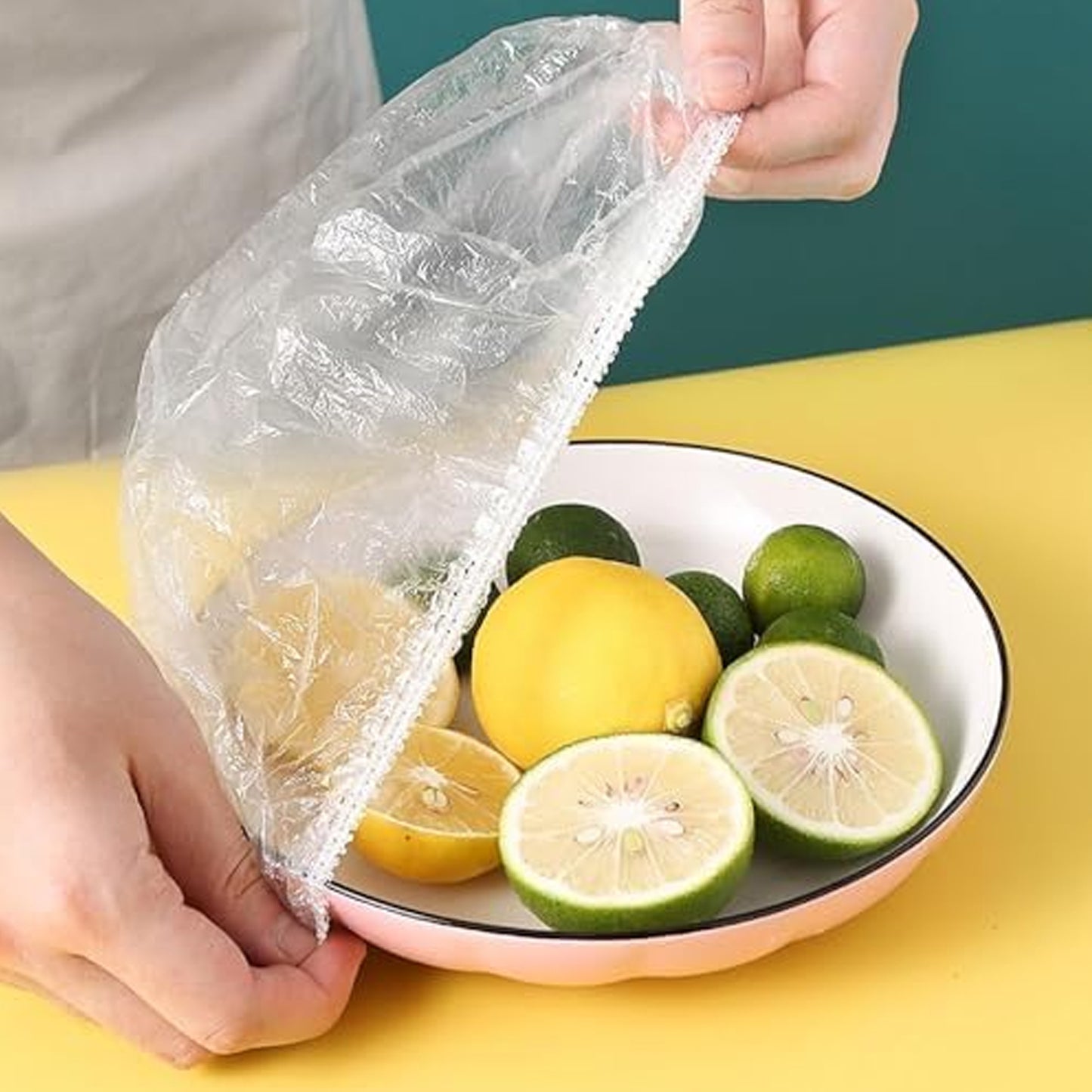 Set of 100 small disposable elastic food storage covers by Wukusy, flexible plastic covers for preserving food freshness.
