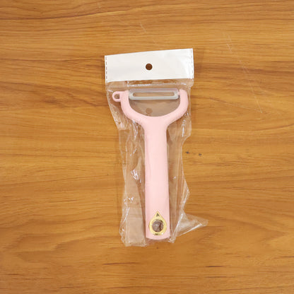 Wukusy handheld vegetable and fruit peeler with ergonomic handle and sharp blade for peeling produce efficiently.