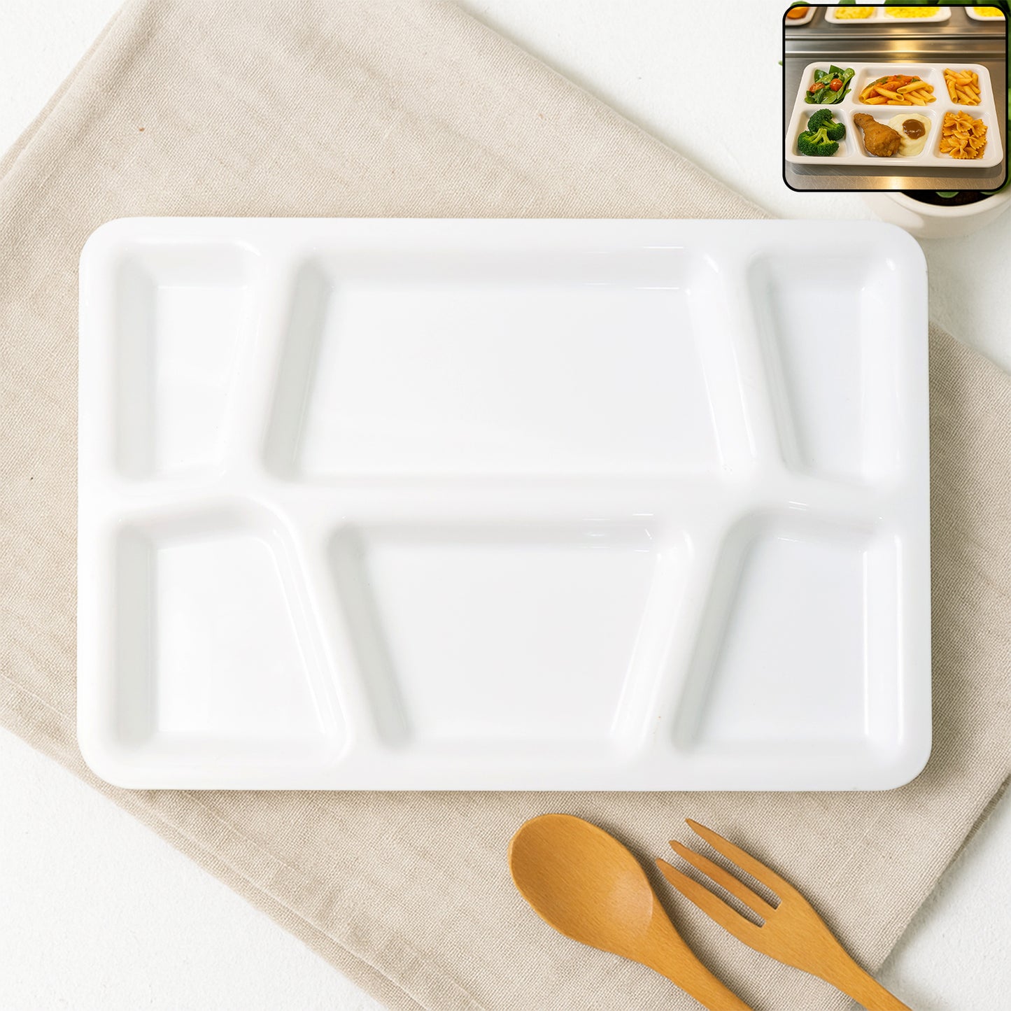 White plastic multi-compartment rectangular meal serving tray by Wukusy, featuring separate sections for organized food presentation.