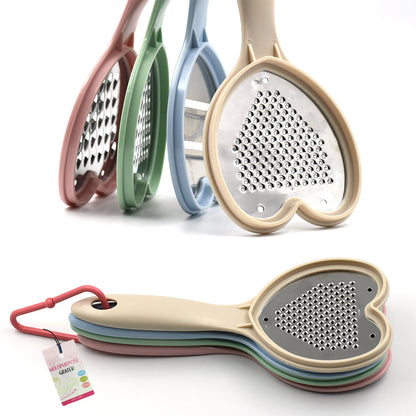 Wukusy Heart Grater Set and Slicer for fruits, vegetables, cheese, and more, used for grating and slicing in the kitchen.