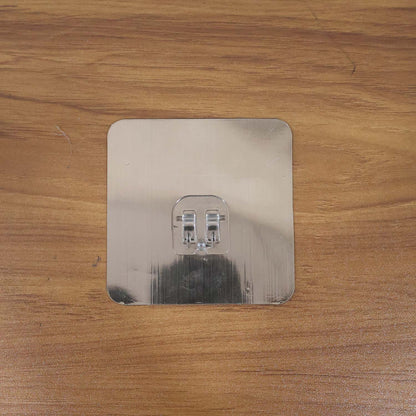 Heavy-duty plastic wall hook by Wukusy, self-adhesive, 8x8 cm for home and kitchen organization, shown attached to a wall.