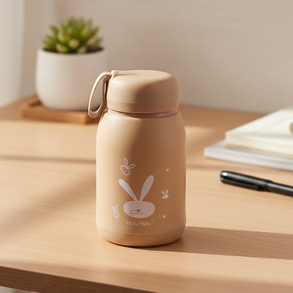 Wukusy glass drinking bottle with cute bunny print, 330ml capacity, brown color, featuring a playful bunny design and secure lid.