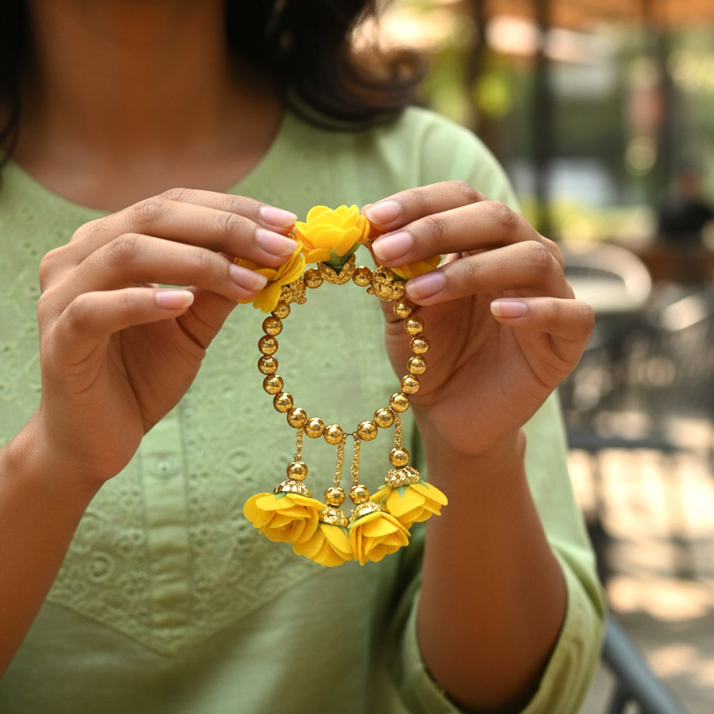 Traditional Wukusy Pooja wrist ornament Haldi Kada bracelet with intricate design, worn on the wrist for religious ceremonies.