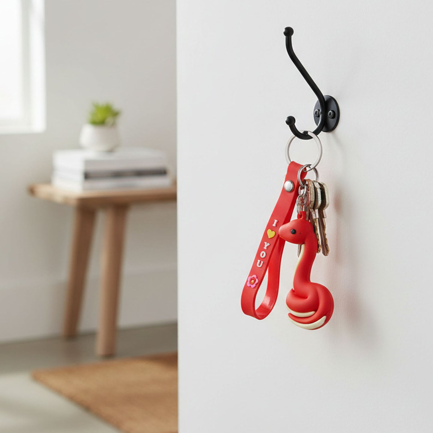 Cute cartoon snake keychain by Wukusy featuring a colorful, playful snake design on a keyring.