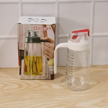 Wukusy glass oil dispenser bottle with auto-flip cap and side handle, 500 ml capacity, for easy oil pouring and storage