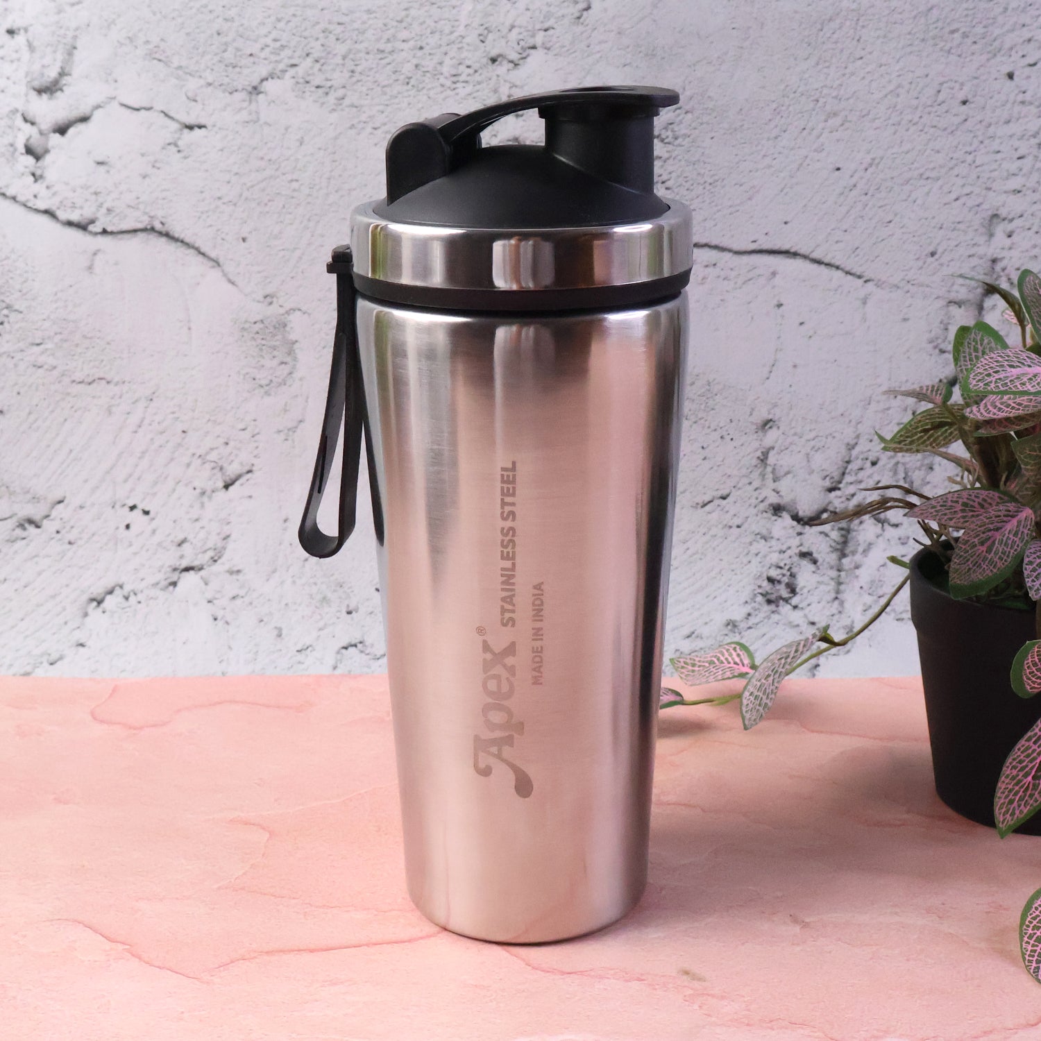 Wukusy Apex stainless steel gym shaker bottle with spring, 1000ml capacity, shown with lid and mixing spring inside.