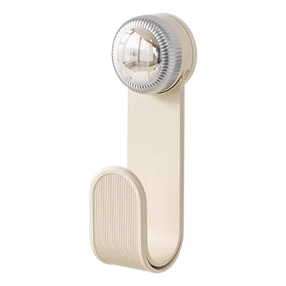 Wukusy adjustable kitchen pot lid holder clip holding a pot lid on a countertop, made of durable metal with a sleek design.