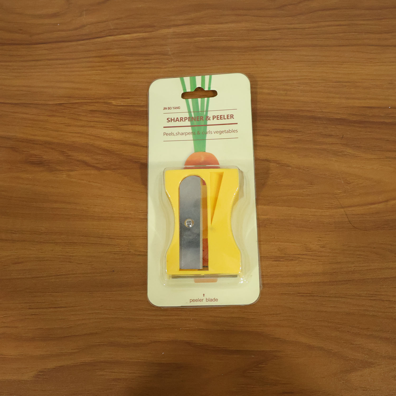 Wukusy multipurpose vegetable peeler tool with ergonomic handle and sharp blade for peeling fruits and vegetables.