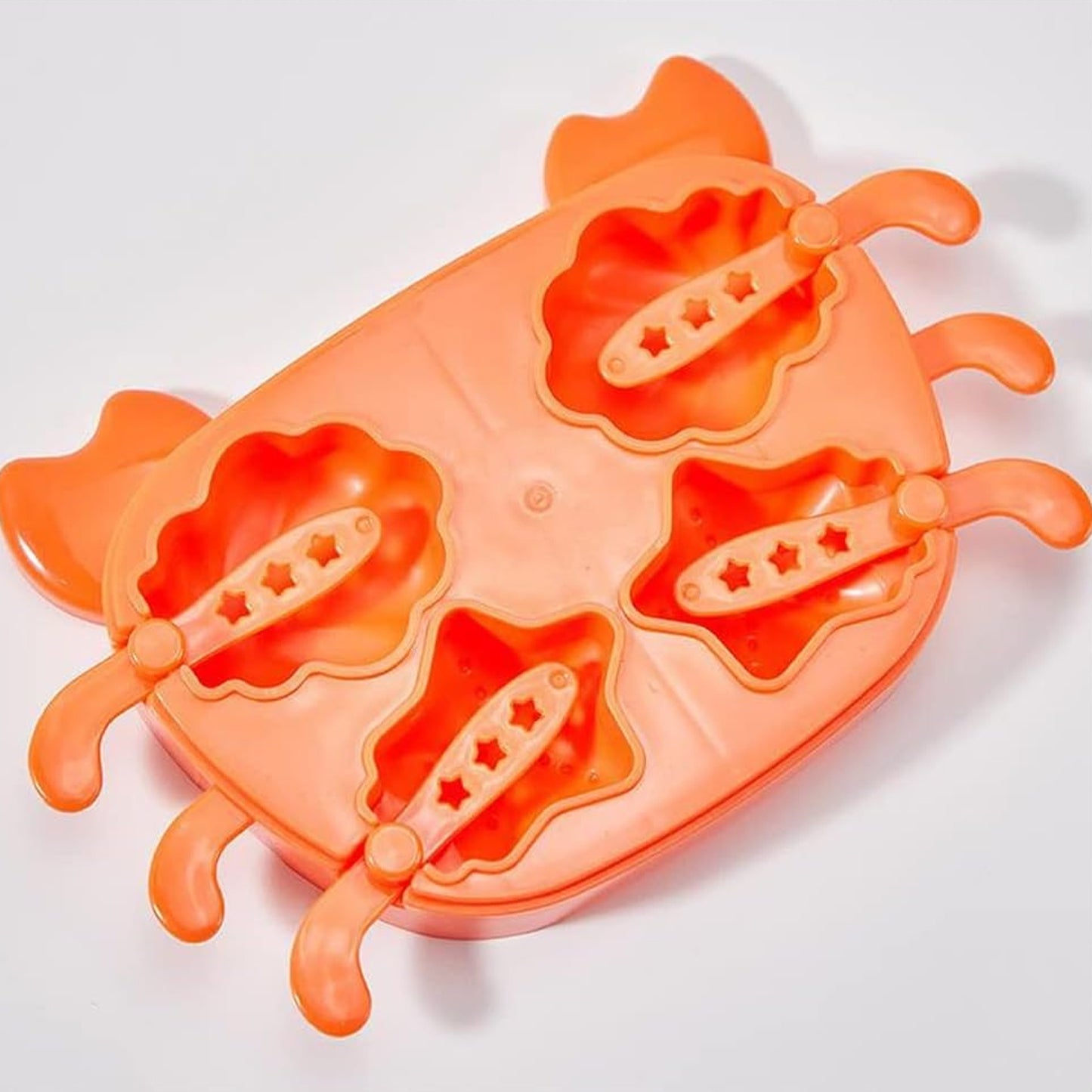 Wukusy 5532 crab-shaped silicone ice cream mold for making popsicles and ice treats in a children's ice box.