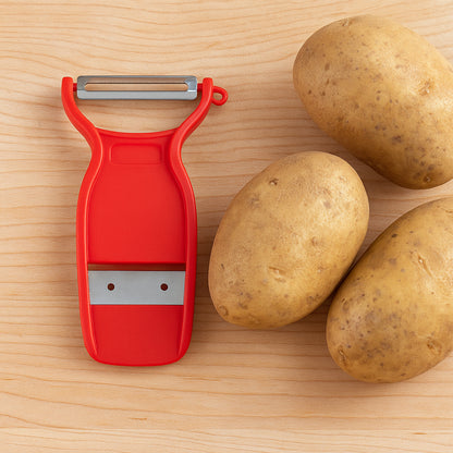 Wukusy Supermom Swiss 2-in-1 slicer peeler with ultra-sharp stainless steel blades for efficient kitchen prep.