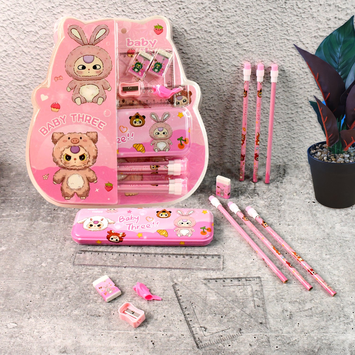 Colorful Wukusy cartoon stationery gift set for kids with 14 pieces including pens, pencils, and erasers arranged on a table.