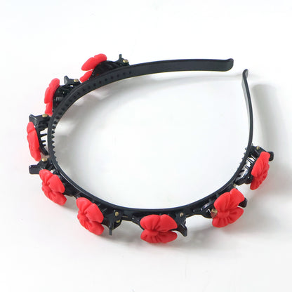 Wukusy decorative floral headband with built-in mini claw clips, featuring colorful fabric flowers and a flexible hair band.