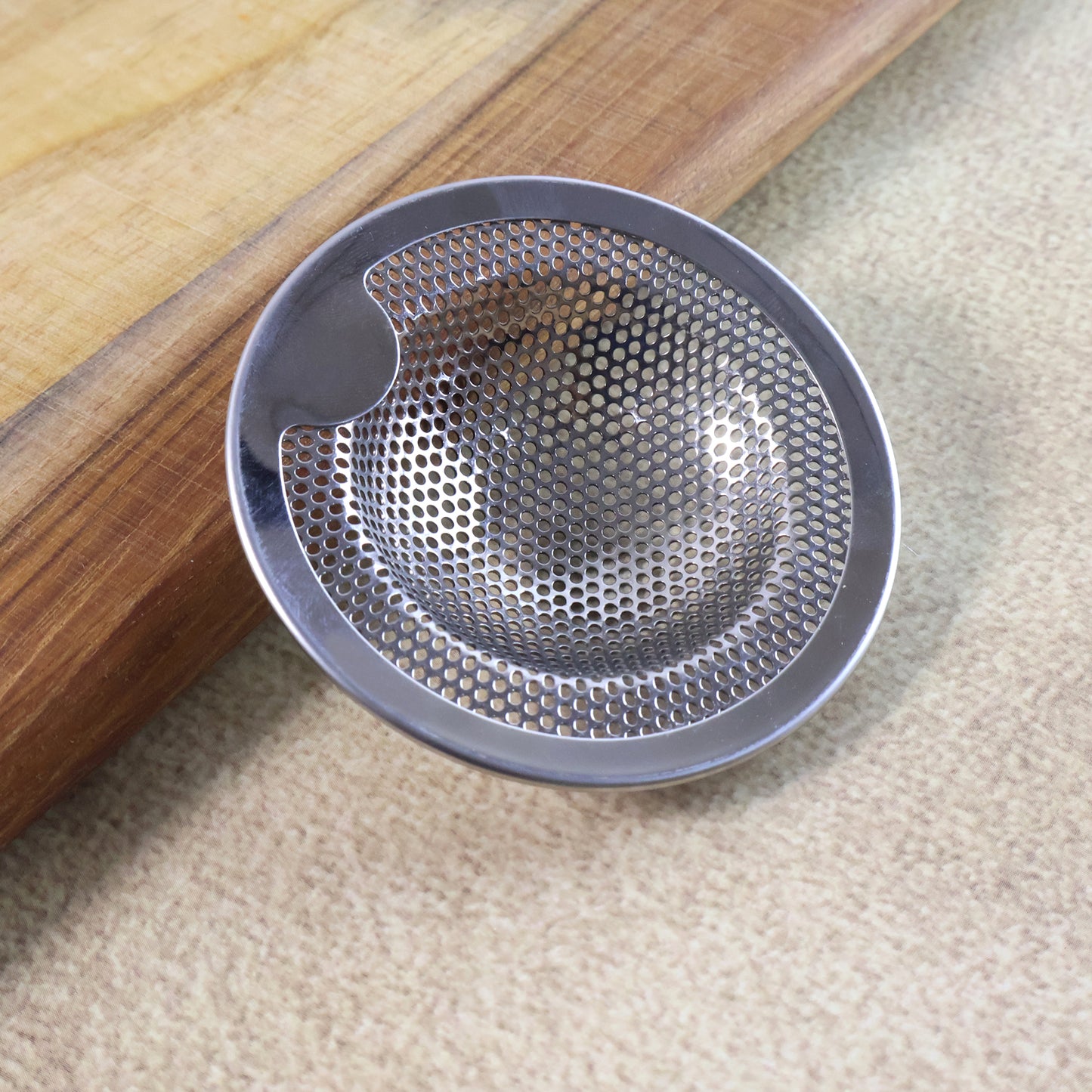 Wukusy stainless steel kitchen sink drain strainer stopper, medium size, designed to catch debris and prevent clogs in home kitchens