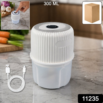 Wukusy USB rechargeable mini garlic chopper crusher, 300ml capacity, compact kitchen tool for garlic and herbs, shown with garlic cloves