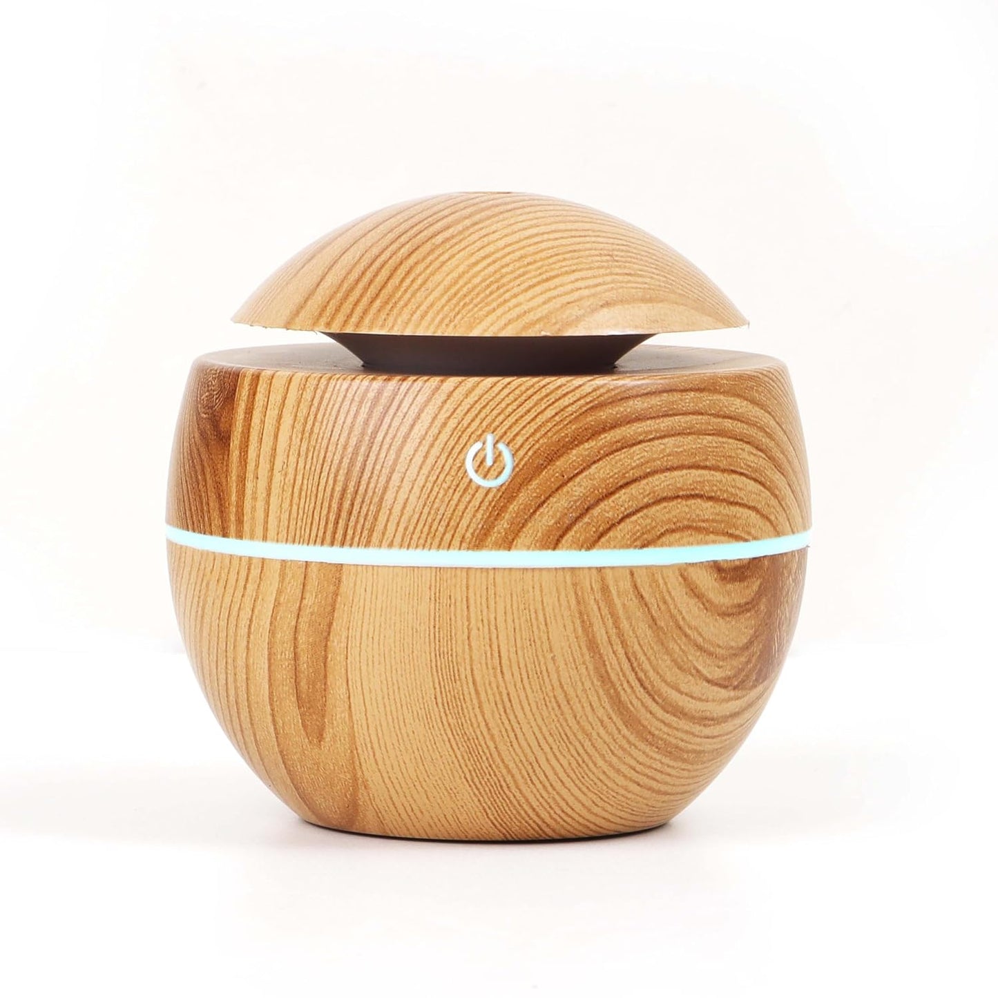 Wukusy ultrasonic aroma diffuser humidifier with 200ml capacity and LED light for home or office use, shown emitting mist and soft glow.