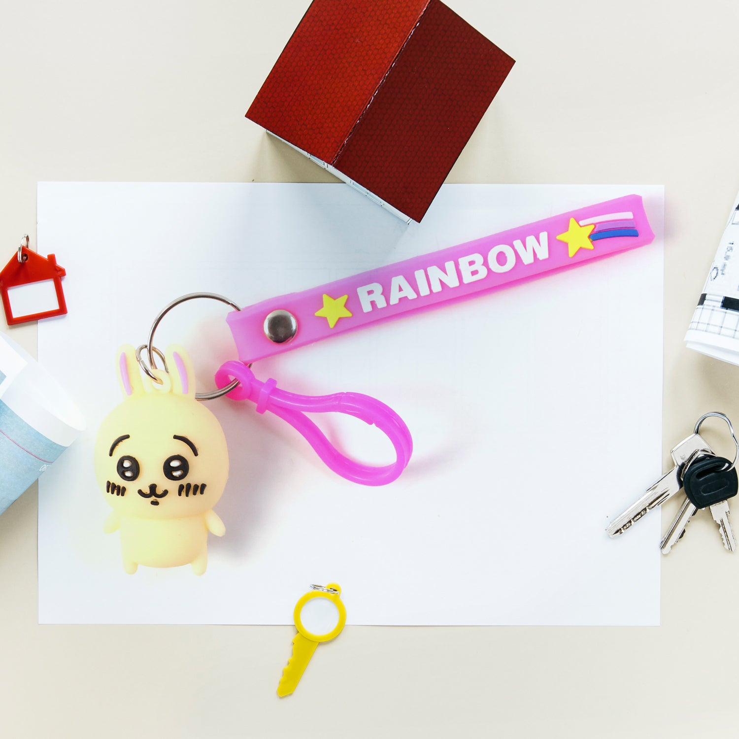 Cute bunny character keychain by Wukusy featuring a plush bunny with soft fur and adorable facial features.