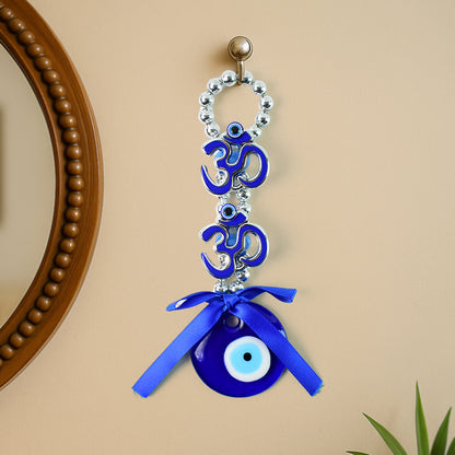 Decorative double Om symbol evil eye hanging ornament by Wukusy, featuring intricate design and vibrant colors on a white background.