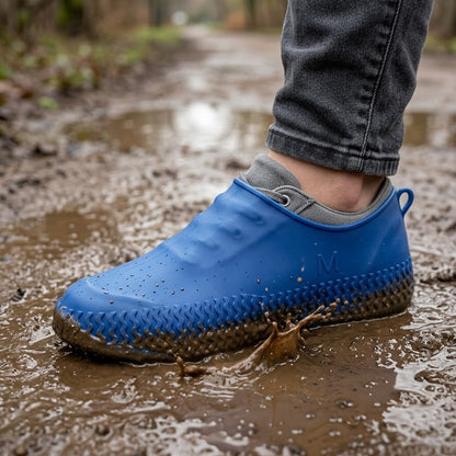 Pair of blue waterproof silicone shoe covers by Wukusy in medium size, showing flexible, protective material for footwear.
