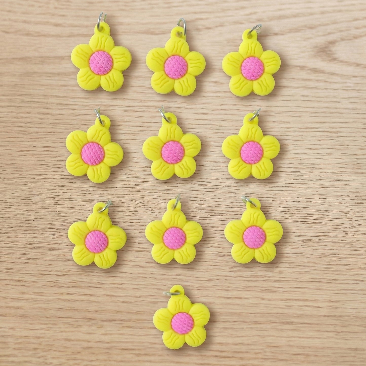 Set of 10 Wukusy flower-shaped bag charm keychains with colorful, cute floral designs on each keychain.
