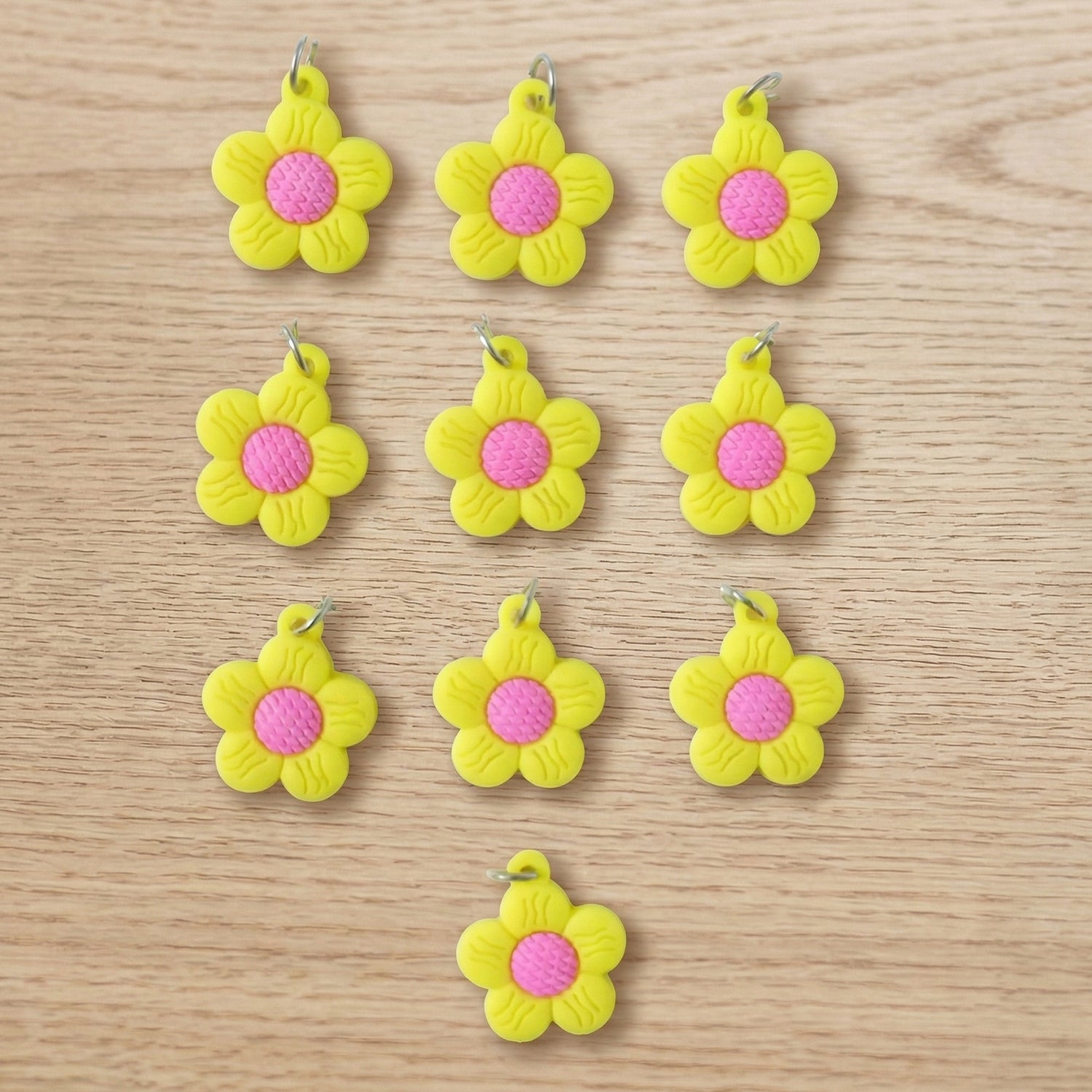 Set of 10 Wukusy flower-shaped bag charm keychains with colorful, cute floral designs on each keychain.