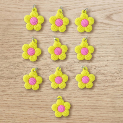 Set of 10 Wukusy flower-shaped bag charm keychains with colorful, cute floral designs on each keychain.
