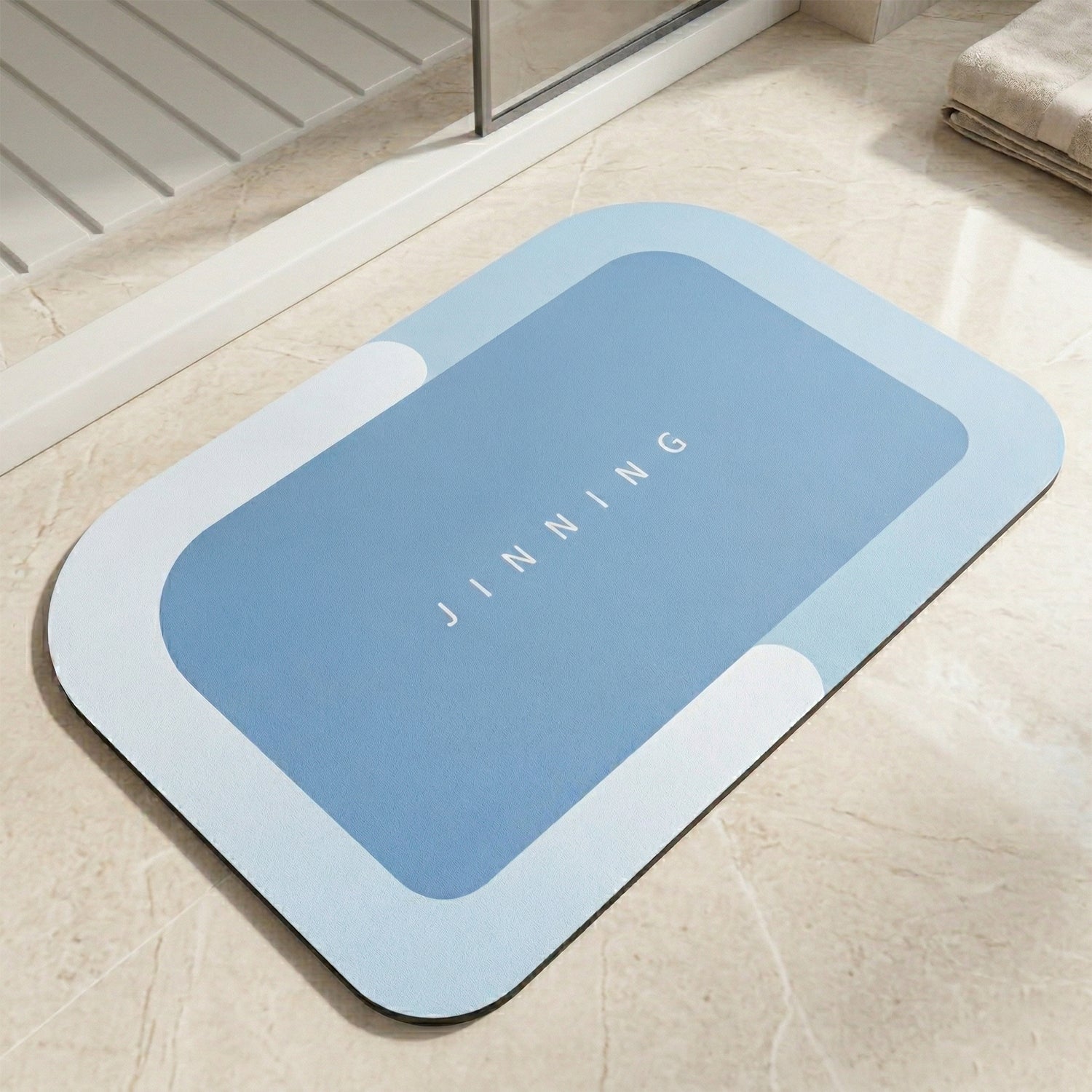Wukusy super absorbent bathroom floor mat 120x74 cm with plush, water-soaking texture on a bathroom floor.