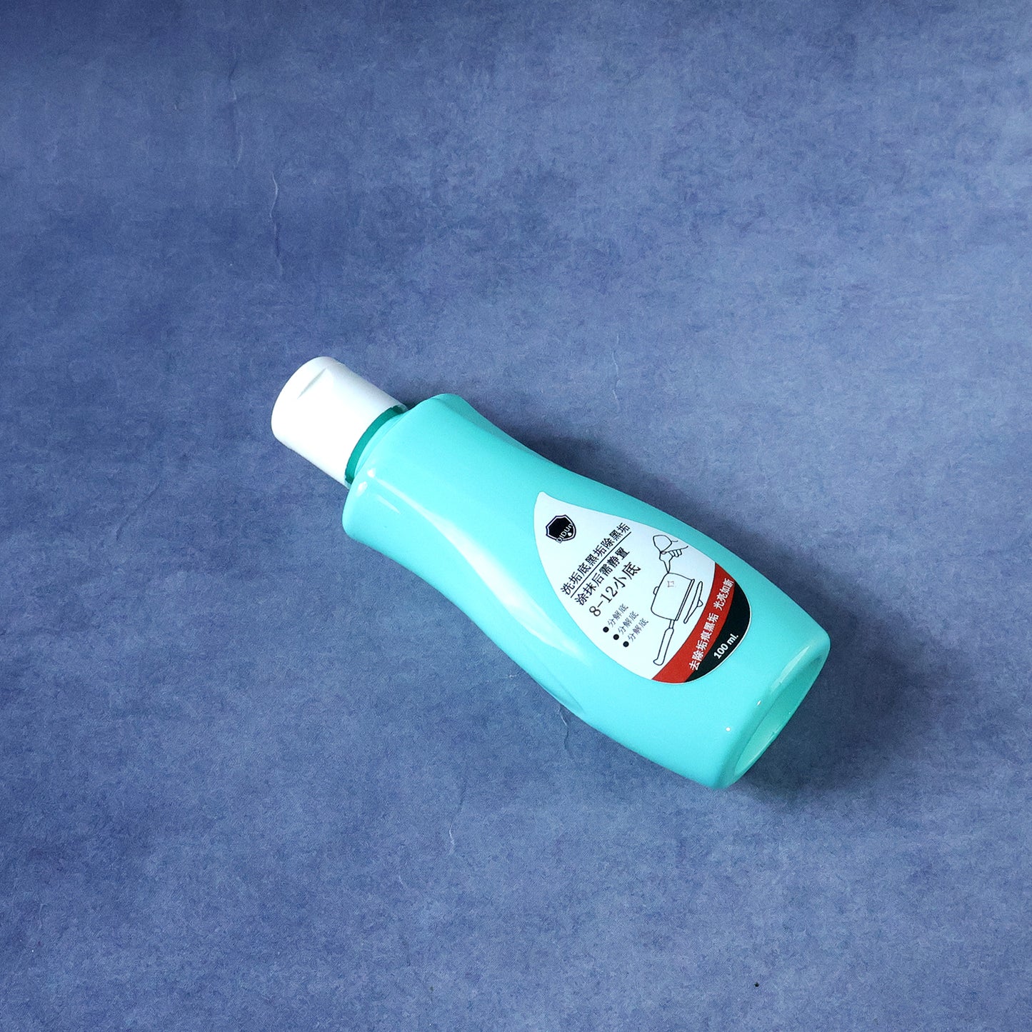 Wukusy cookware bottom cleaner liquid in 100ml bottle, designed to remove stains and residue from pots and pans.