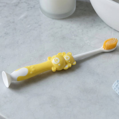 Kids cartoon design toothbrush set with musical whistles by Wukusy, featuring colorful handles and playful character details.