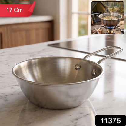Stainless steel small tadka pan with long handle for tempering, 11 cm, by Wukusy, shown with oil and spices inside.