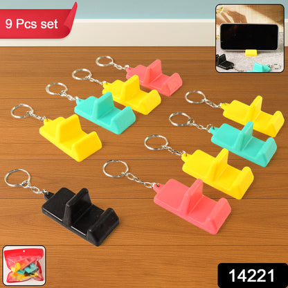 Wukusy plastic 2-in-1 mobile stand keychain with nine pieces, compact mobile accessory featuring a keychain and stand function.