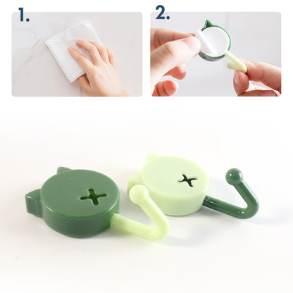 Set of 10 Wukusy self-adhesive round wall hooks attached to a wall for hanging items in home improvement projects.
