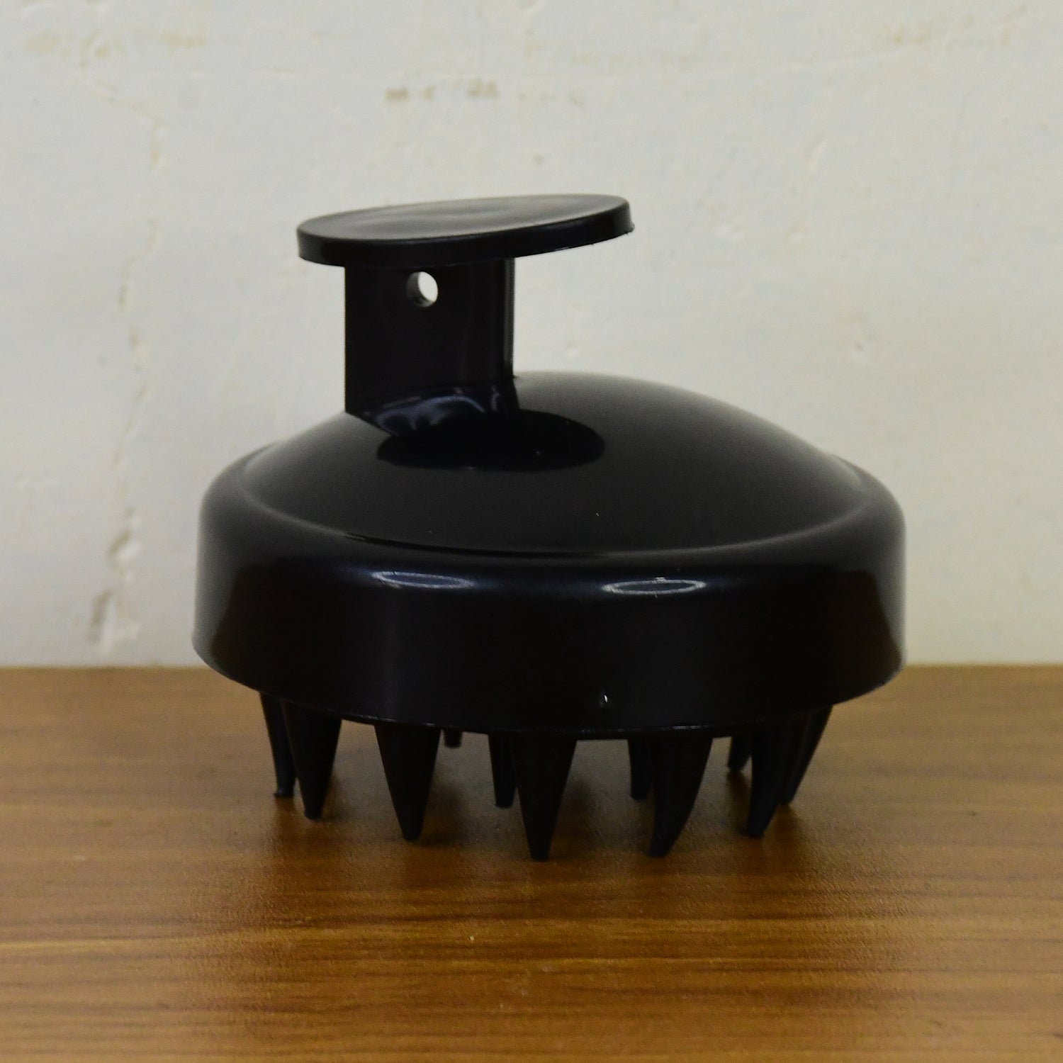 Wukusy scalp massager shampoo brush showing soft silicone bristles for gentle scalp cleansing and massage in a health and beauty setting.