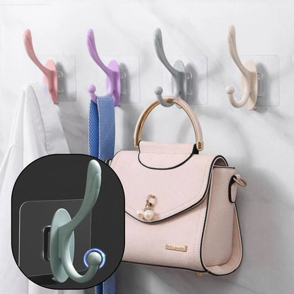 Wukusy 4687 self-adhesive plastic wall hook attached to a wall, ideal for home organization and hanging lightweight items