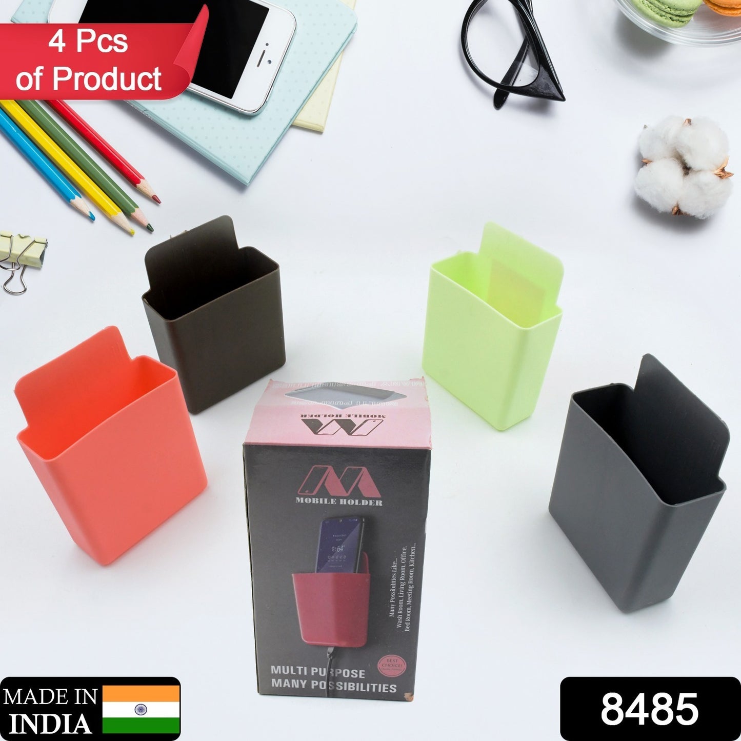 Pack of 4 Wukusy plastic wall-mounted remote and mobile holder stands for organized storage.