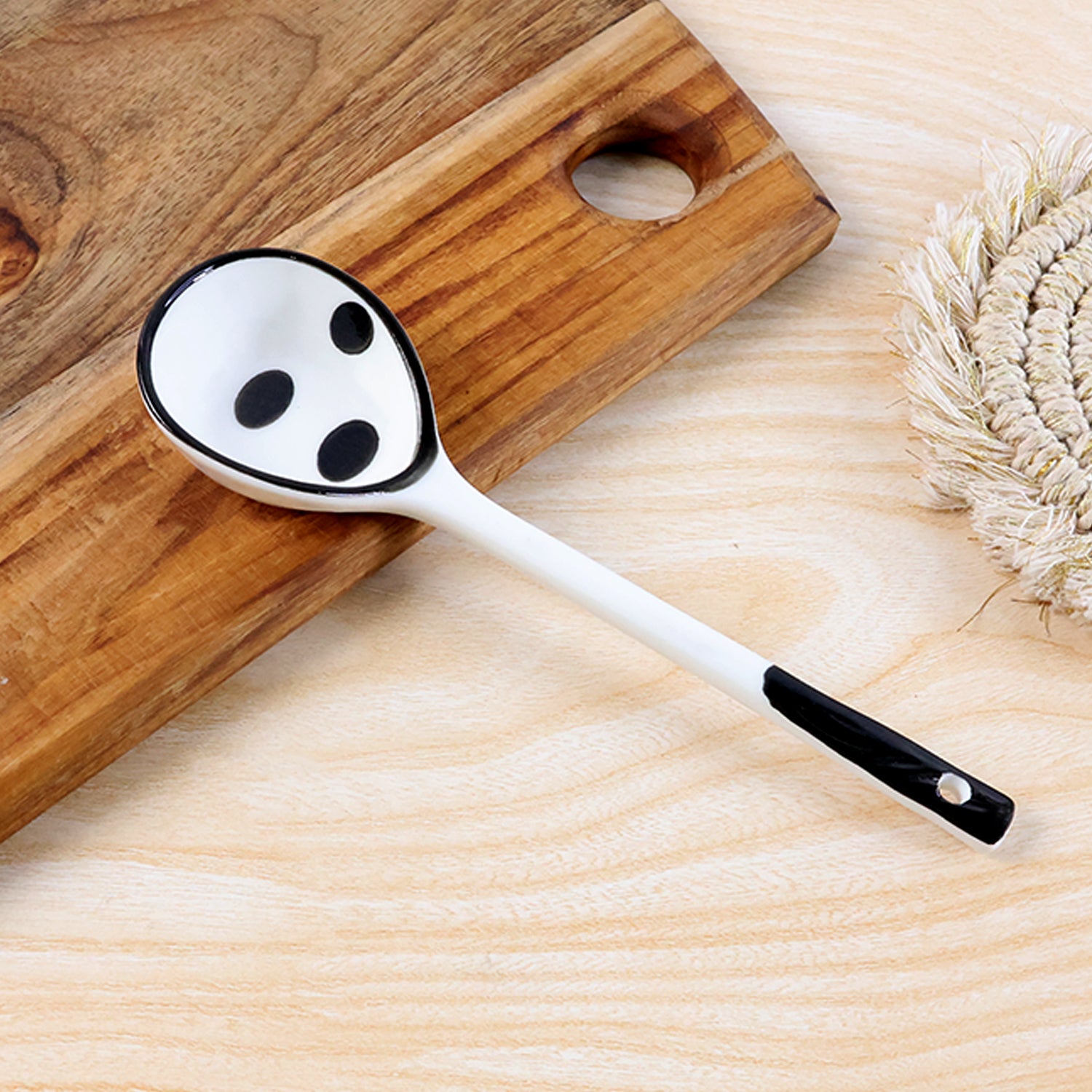 Wukusy premium 17 cm heat-resistant ceramic soup ladle with a long handle and smooth bowl for serving hot soups and stews.