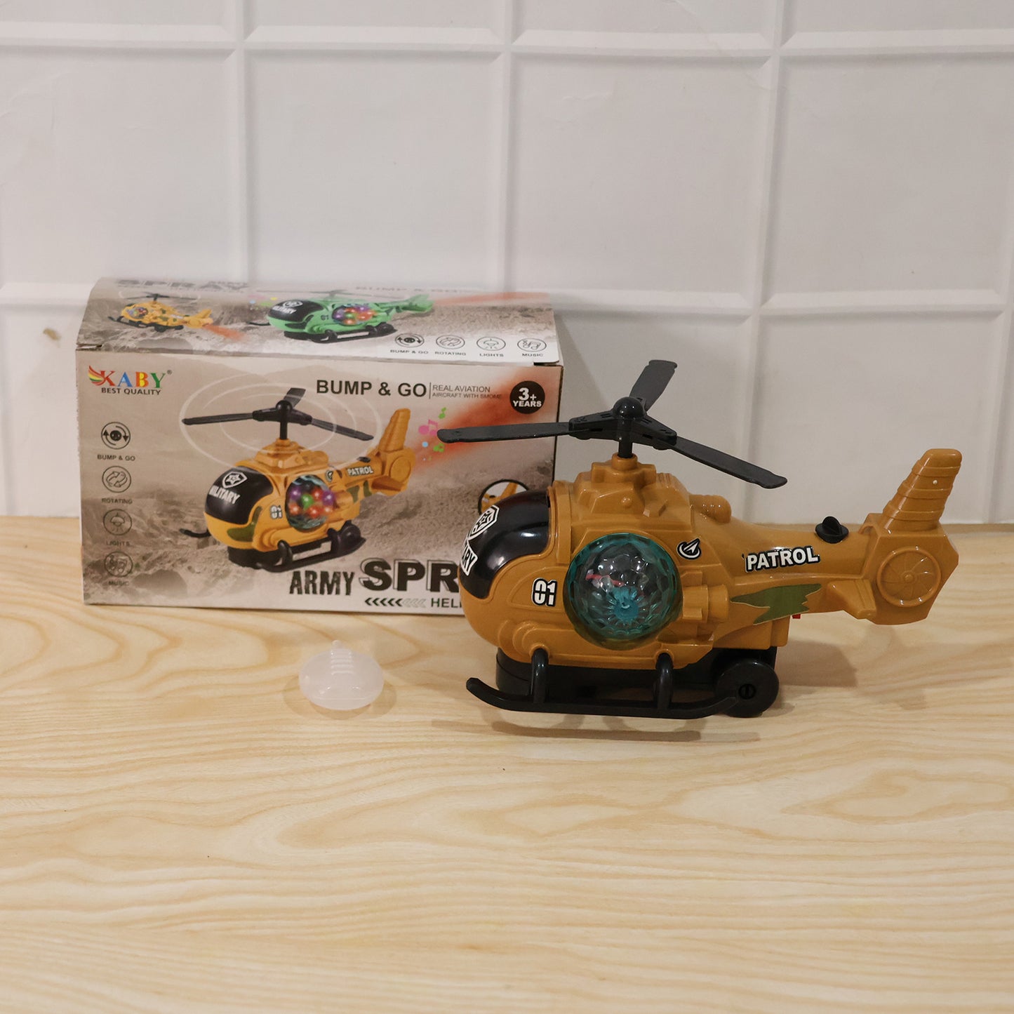 Wukusy military spray helicopter toy for kids with lights, music, and mist, featuring a bump and go design in vibrant colors.