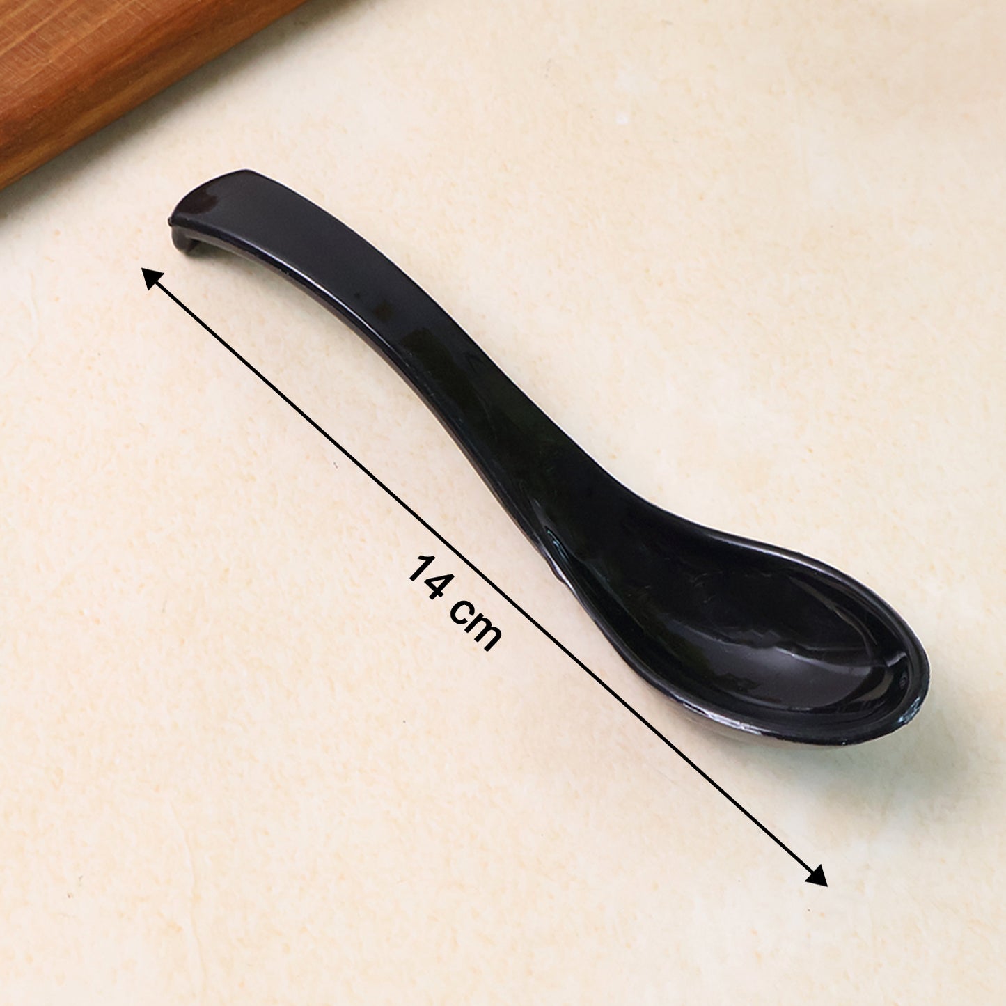 Black plastic soup spoon with deep bowl, ideal for home and kitchen use, by Wukusy.