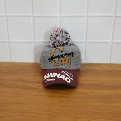 Wukusy winter baseball-style woolen cap, trendy and warm, shown in a close-up view featuring its classic design and cozy fabric.