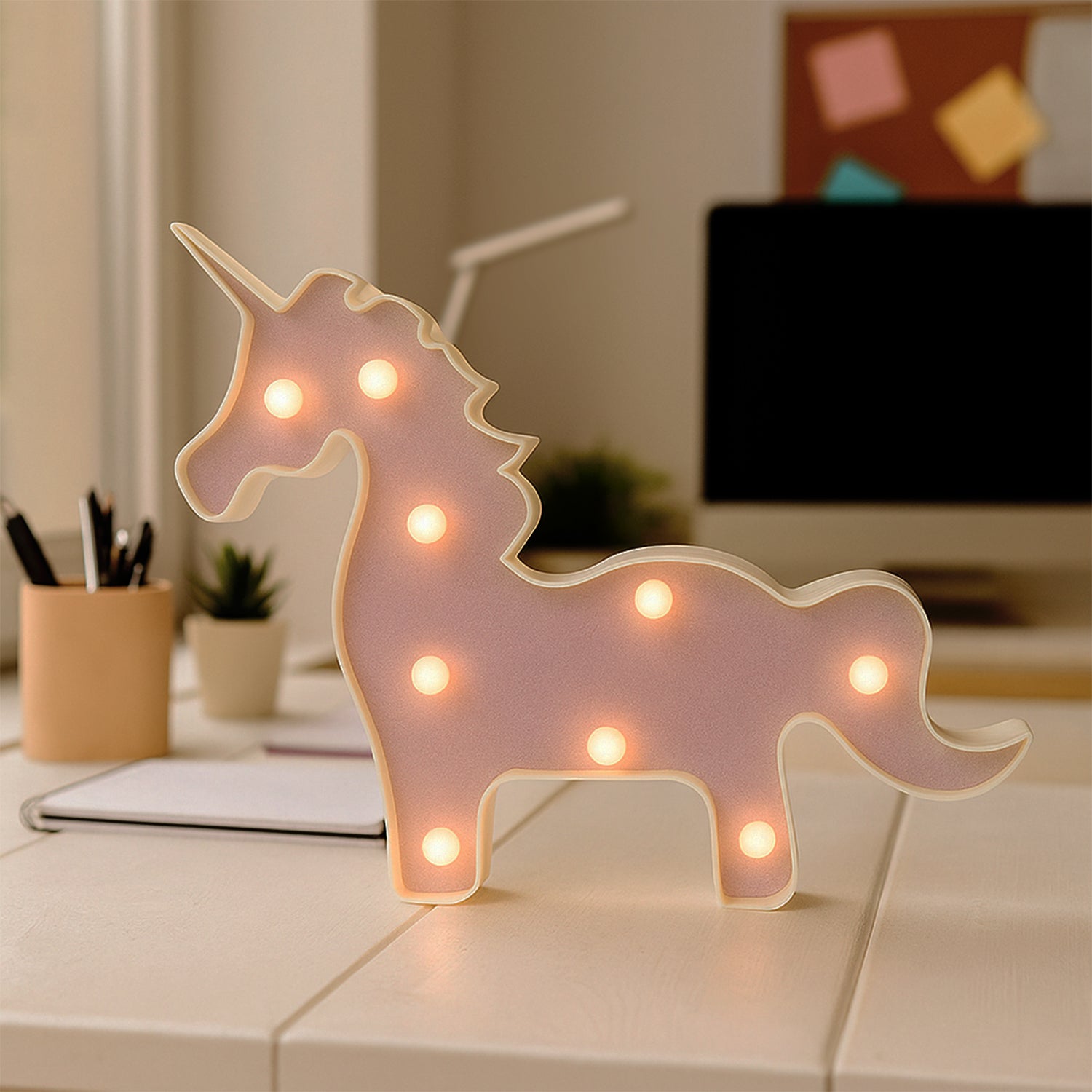 Wukusy magical unicorn LED night light, shaped like a unicorn, illuminating a cozy bedroom decor with soft, colorful light.