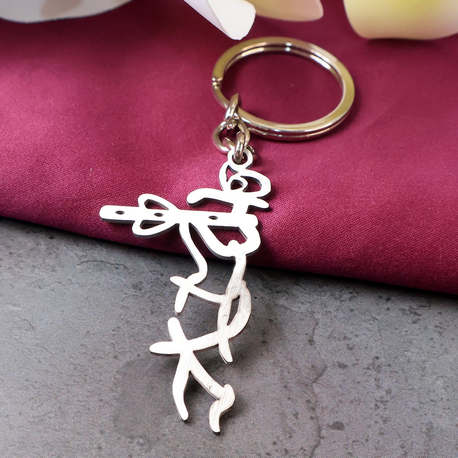 Wukusy Divine Krishna flute design metal keychain with intricate detailing, featuring a small Krishna figure and traditional motifs.