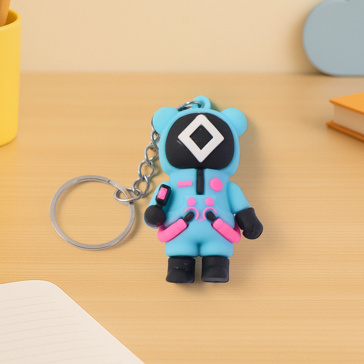Cute character-themed soft silicone keychain featuring a playful design, perfect for attaching to keys or bags.